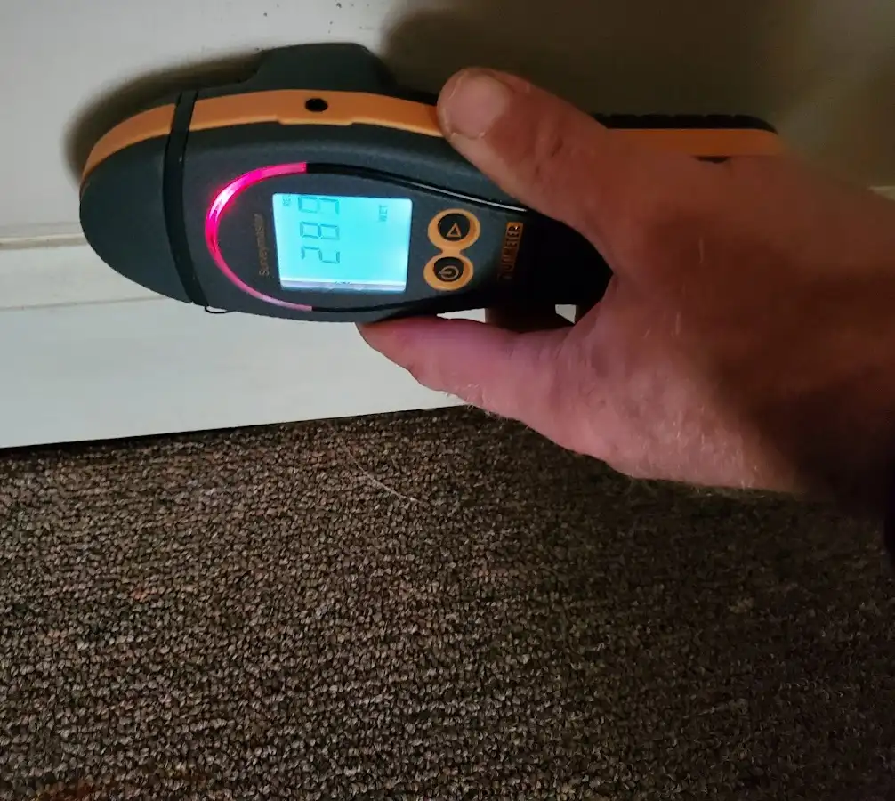 Moisture detection at baseboard during Storm Damage Restoration in South Abington